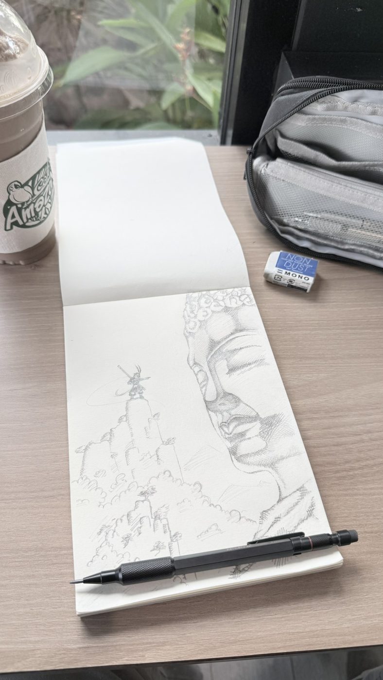 Pencil sketch in Smud's sketchbook: a warrior with a staff on a rocky peak beside a great Buddha face